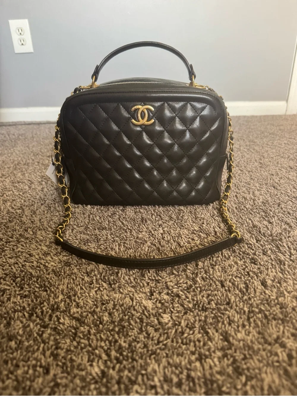 CHANEL Calfskin Quilted CC Vanity Case in black with gold hardware